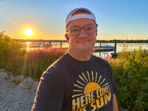 Albert Perry, The Sunrise Warrior, standing in the morning sunlight during a sunrise walk.
